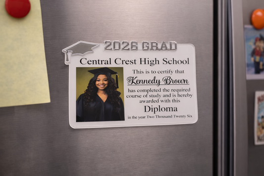 Graduation-themed magnet on a refrigerator with a photo of a graduate and text. Graduation-themed magnet on a refrigerator with a photo of a graduate and text.