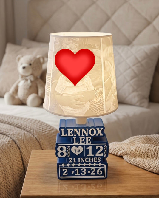 Decorative lamp with pictures and heart design covering face on a bedside table, featuring 'Lennox Lee' and measurements.