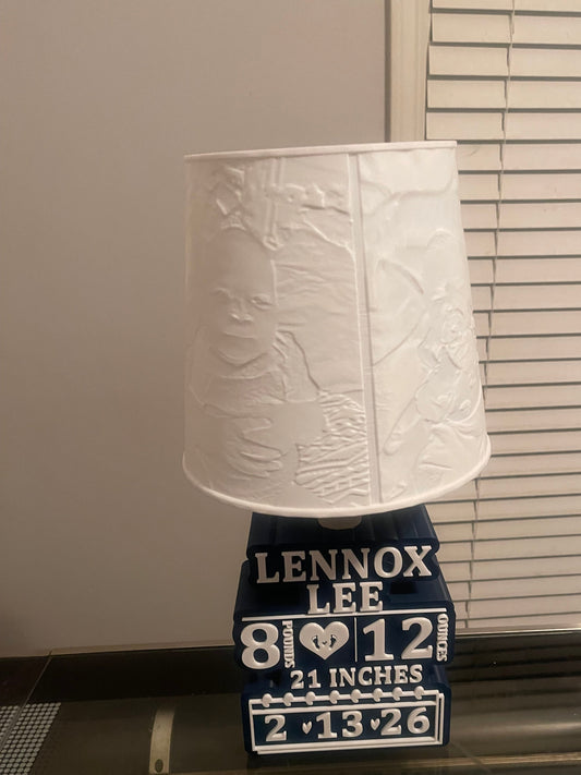 Lamp with pictures with a Lennox Lee label on a neutral background